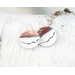 round flame painted and white copper enameled earrings with blackened sterling wire representing running wolves across snow